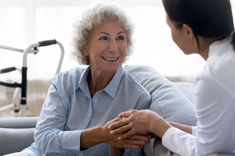 elderly woman talking to a doctor