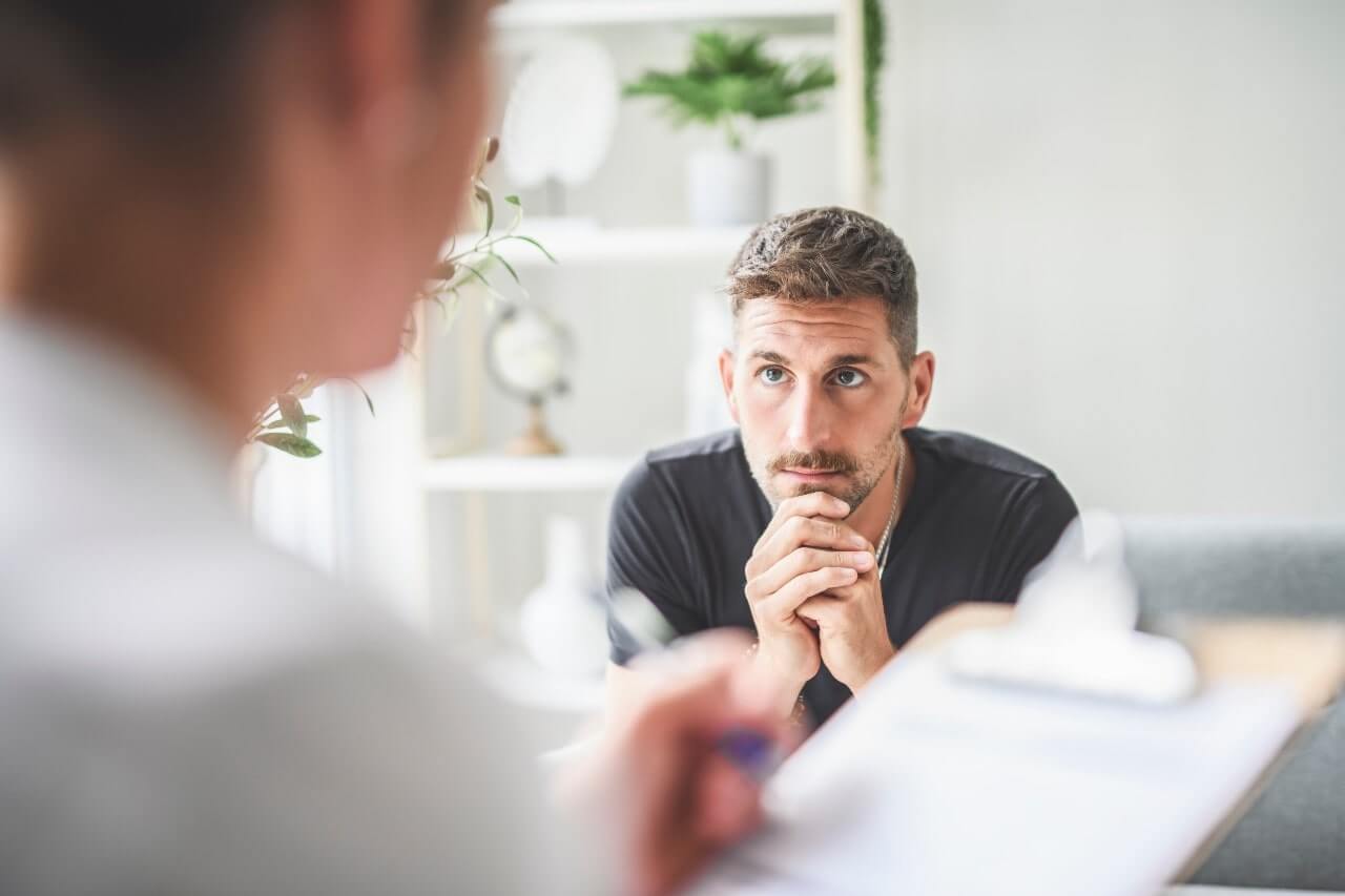 man hearing results from doctor