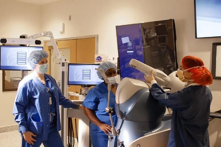 three doctors setting up equipment