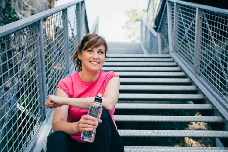 woman sitting on the stairs