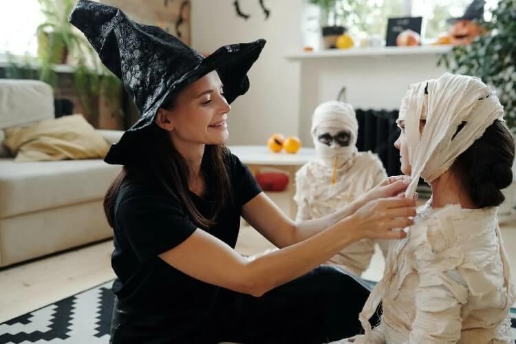 mom helping with their childs costume