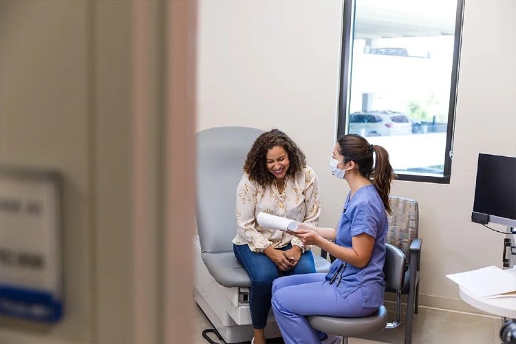 nurse consulting a patient