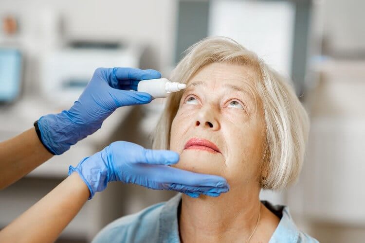 a woman getting an eye drop