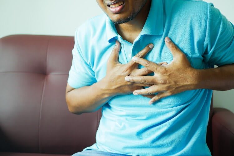 man holding his chest