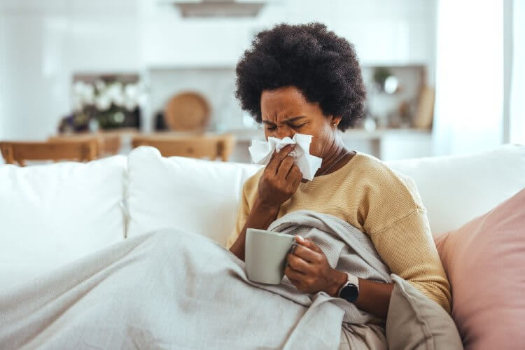 woman sneezing