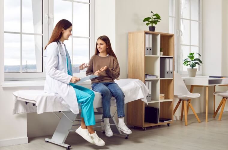 doctor talking to a teenager