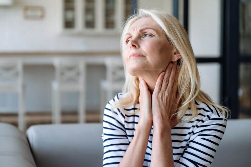 woman checking her neck