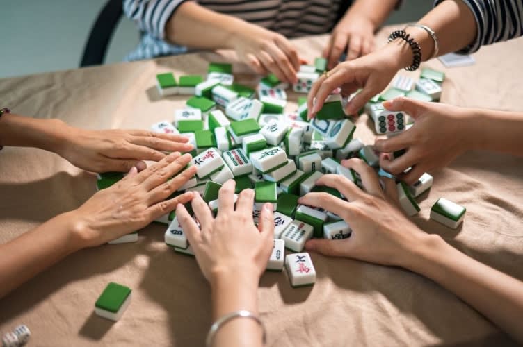 mahjong tiles being shuffled