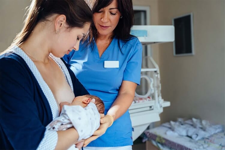 a mother breastfeeding her baby