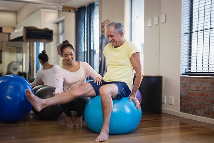 physical therapist assisting a patient
