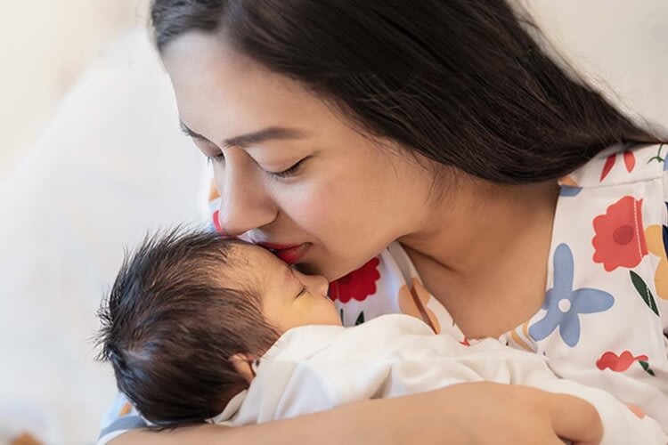 a mother with her newborn baby