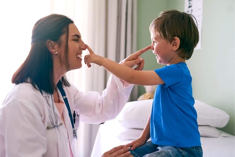 pediatrician checking on a child