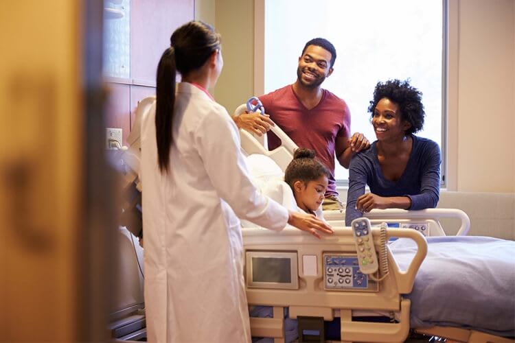 doctor talking to a family