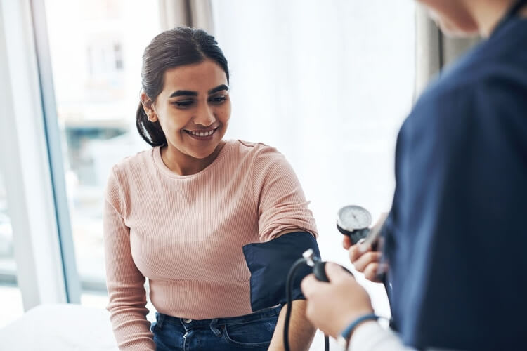 patient getting their blood pressure checked