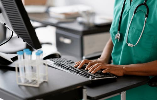 person typing on a keyboard