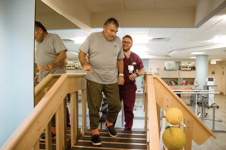 patient being assisted by a nurse