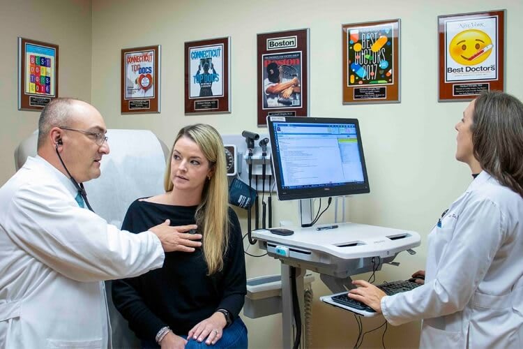 doctor checking in on a patient