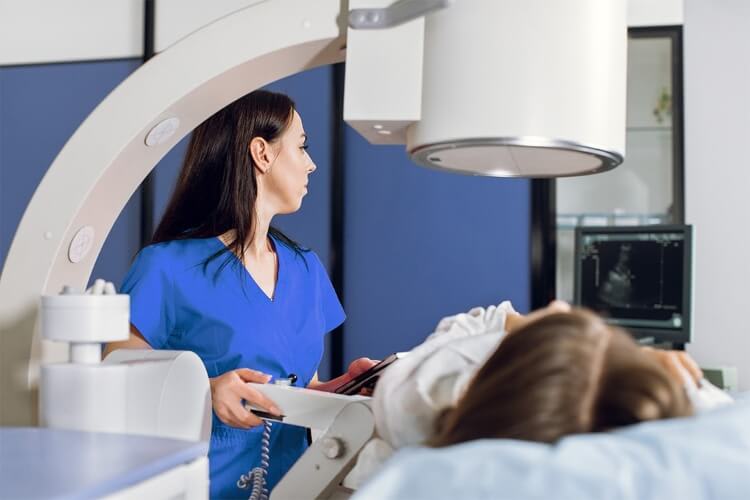 a woman getting scanned