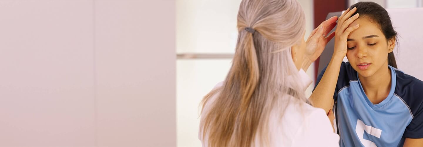 girl holder her head