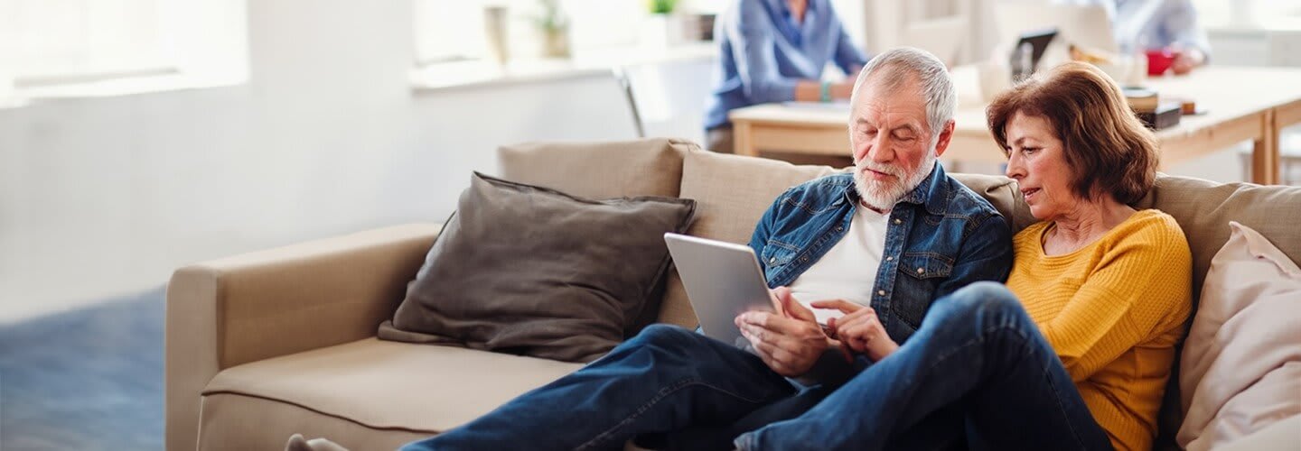 older couple looking at an ipad