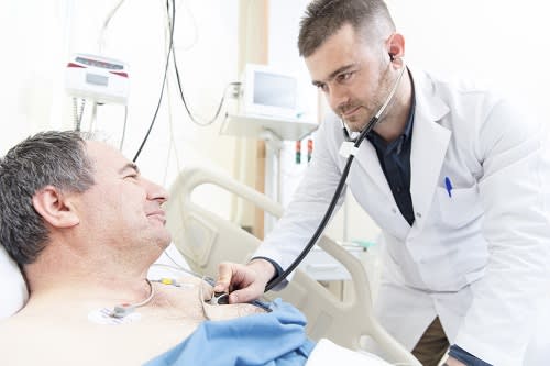 Doctor with patient and stethoscope