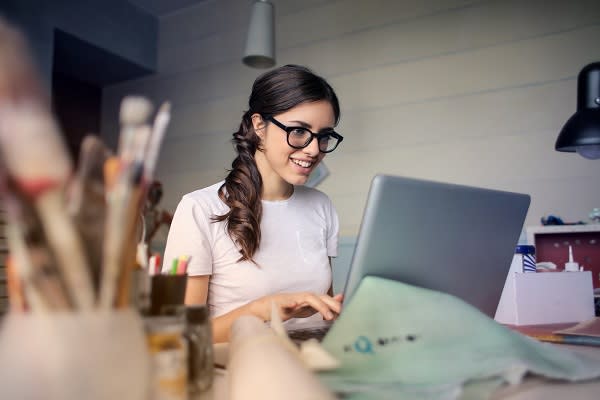 Woman in 20s researching on laptop