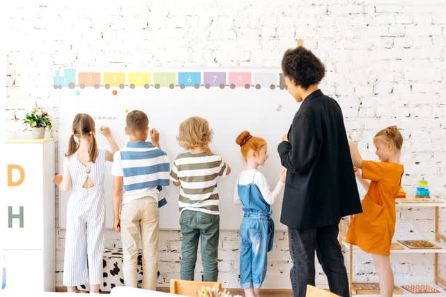 Young Children in Clasroom with Teacher