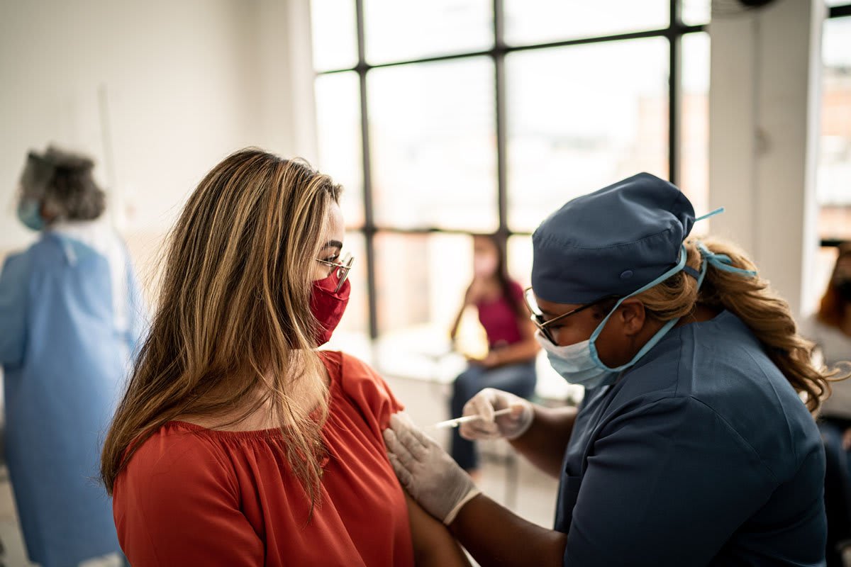 nurse giving vaccine